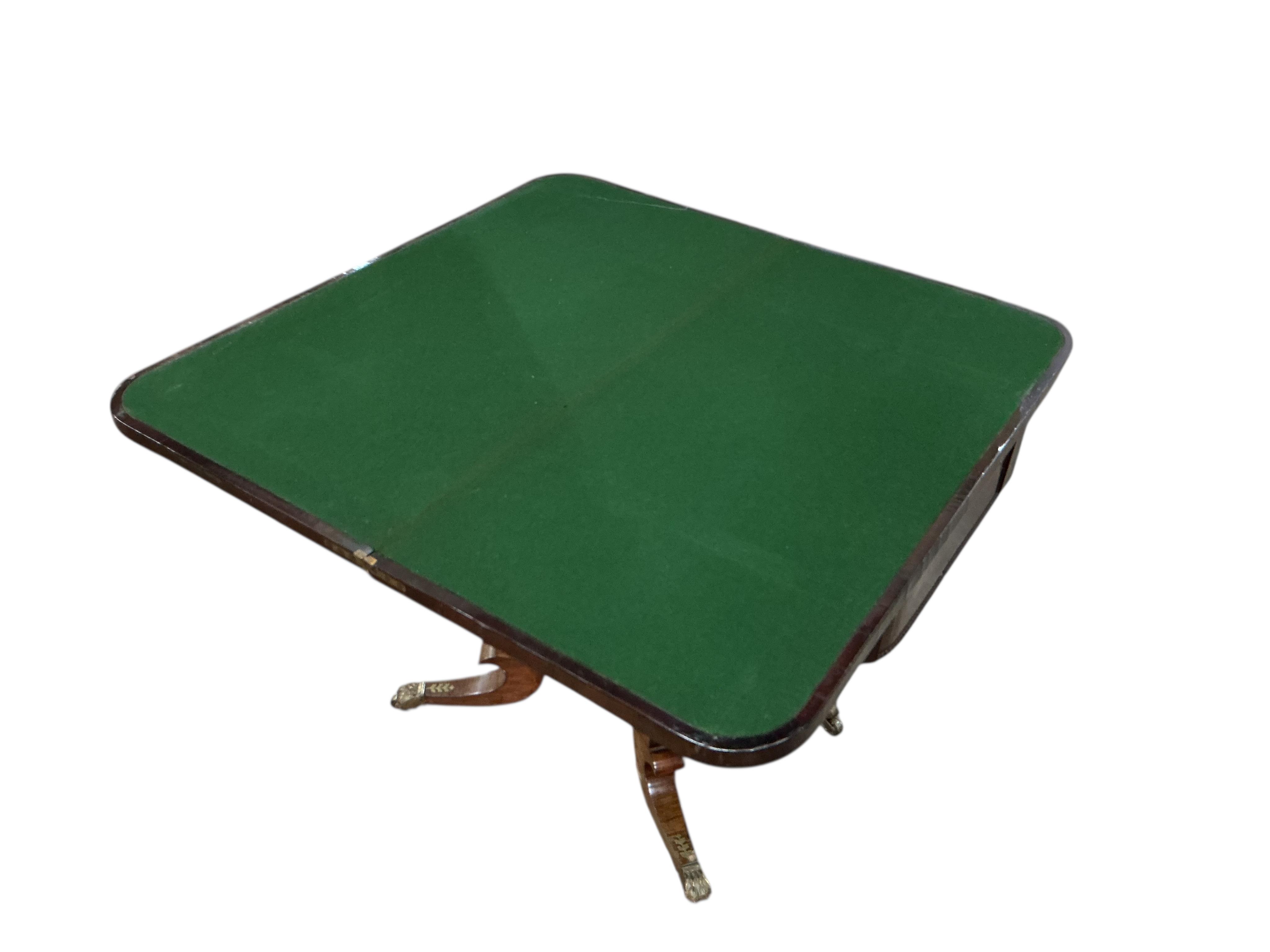 A Regency rosewood and cut brass inlaid pedestal folding card table, width 91cm, depth 45cm, height 73cm